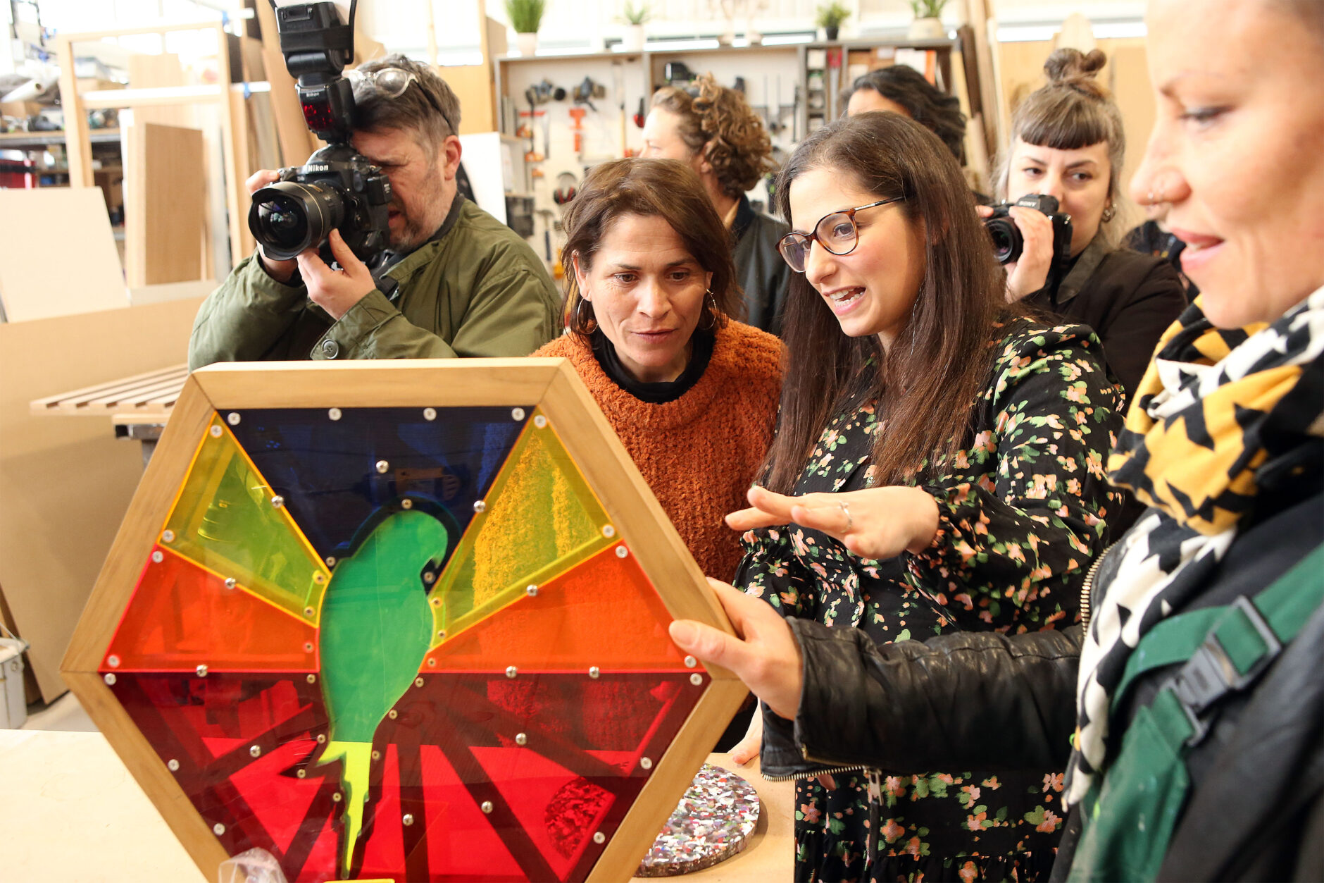 Manilo Seco, Workshop Manager, and Lizzie Fleming, founder, Made From Scratch, which creates adventure playgrounds, show their work to Nesil Caliskan, Leader, Enfield Council, at the launch of Building Bloqs' new open access factory, 10 February 2022. Photo courtesy of Enfield Council.