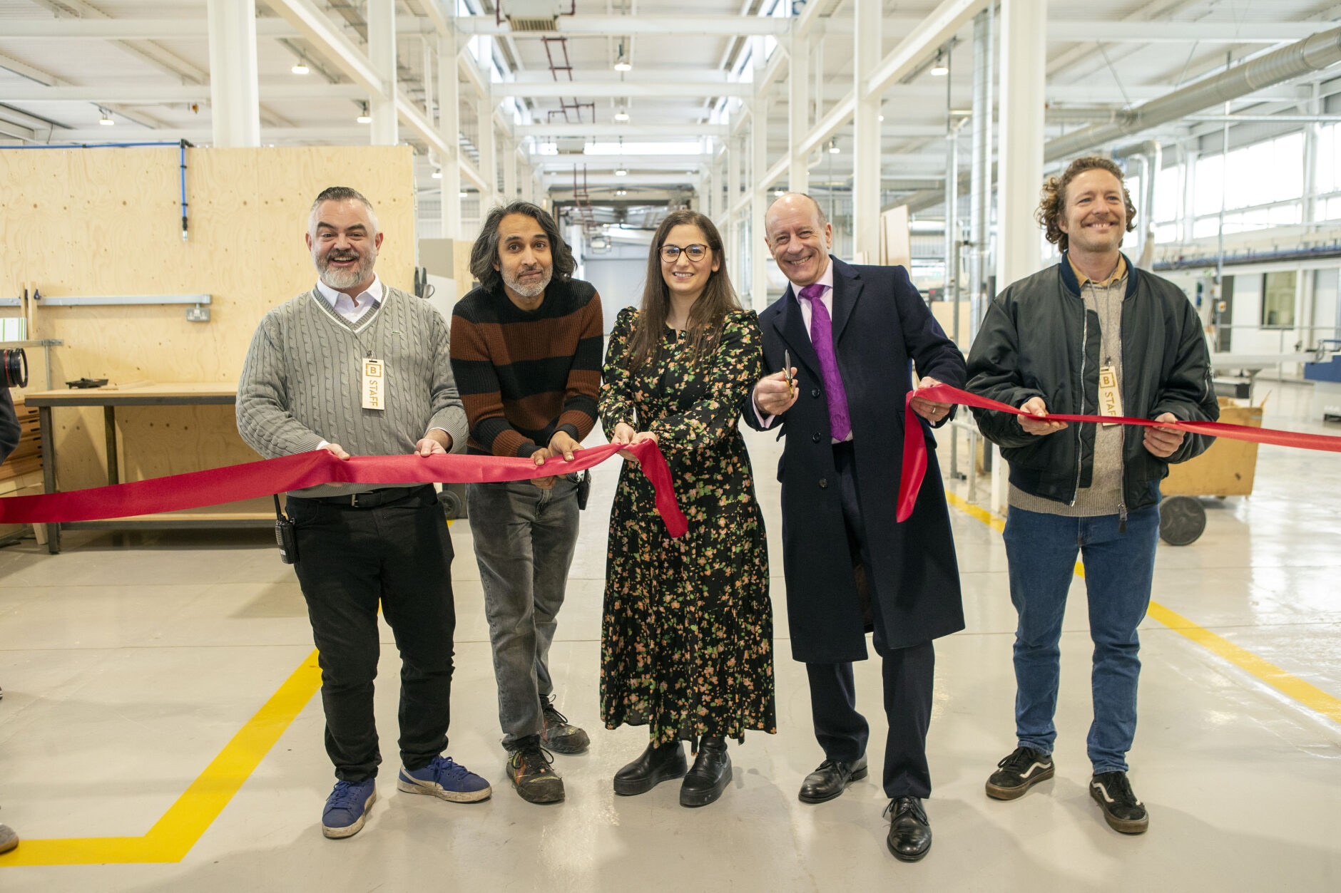 Nesil Caliskan, Leader, Enfield Council and Jules Pipe, Deputy Mayor of London, Regeneration, Skills and Planning, join Building Bloqs' co-founders and directors Al Parra, Vinny Navray (from left) and Arnaud Nichols (right) in celebrating the opening of Building Bloqs' new open access factory at Meridian Water, Upper Edmonton, 10 February 2022. Architects: 5th Studio. Photo courtesy of Enfield Council.