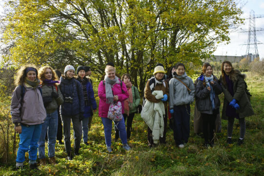 Participants in the Foraging and Sustainable Photography workshop led by artist Kathryn Atrill at Bloqs' new open access factory in one of its meeting spaces, foraging in the nearby Tottenham Marshes, 4 December 2021. Photo: Elijah Serumaga.