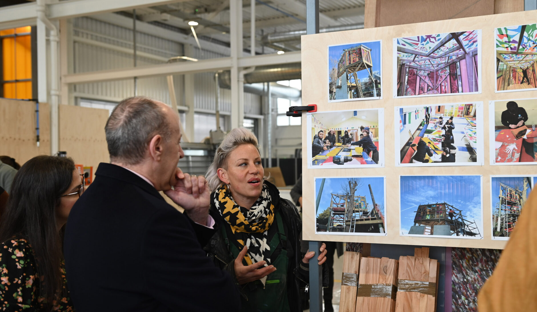 Bloqs' maker member Lizzy Fleming, founder of Made From Scratch, shows her work to Nesil Caliskan, Leader, Enfield Council, and Jules Pipe, Deputy Mayor of London, at the launch of Building Bloqs' new open access factory. Architects: 5th Studio. Photo: Stuart Wilson for Getty.